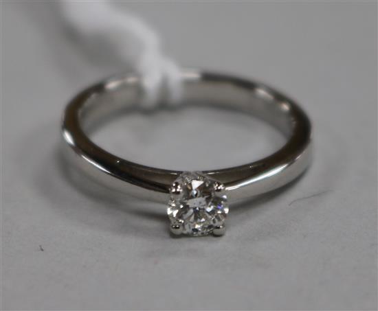 An 18ct white gold and solitaire diamond ring, the stone weighing 0.29cts, size K.